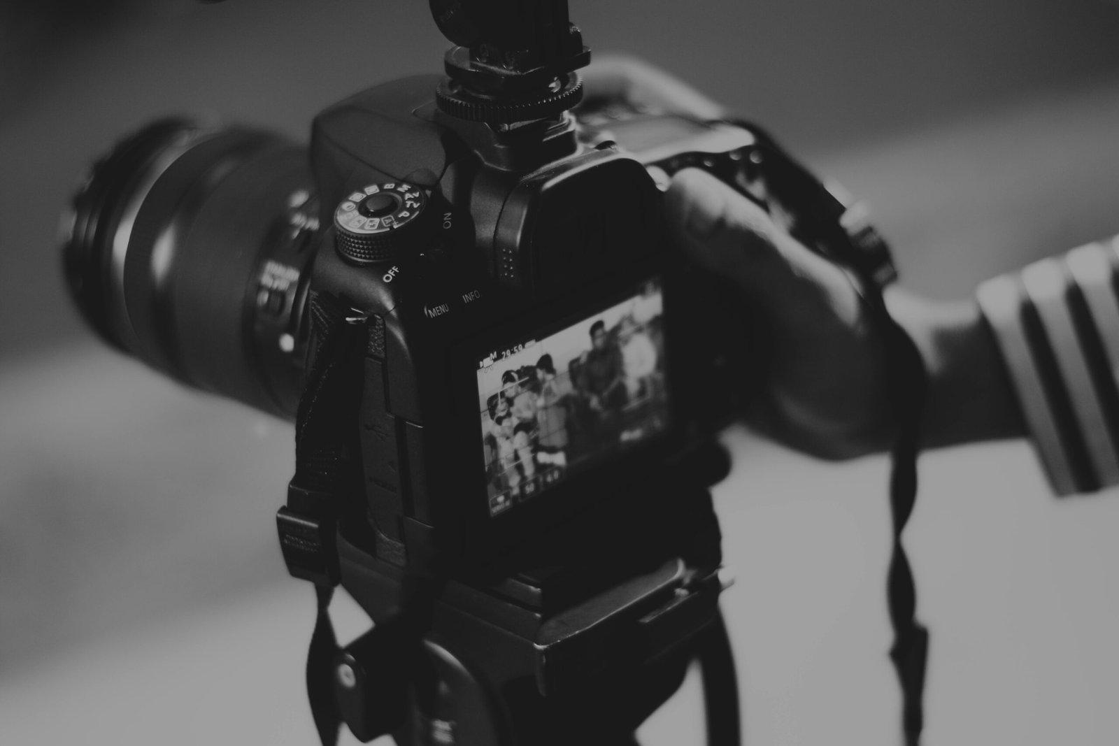 Black Camera Lens on Brown Wooden Table